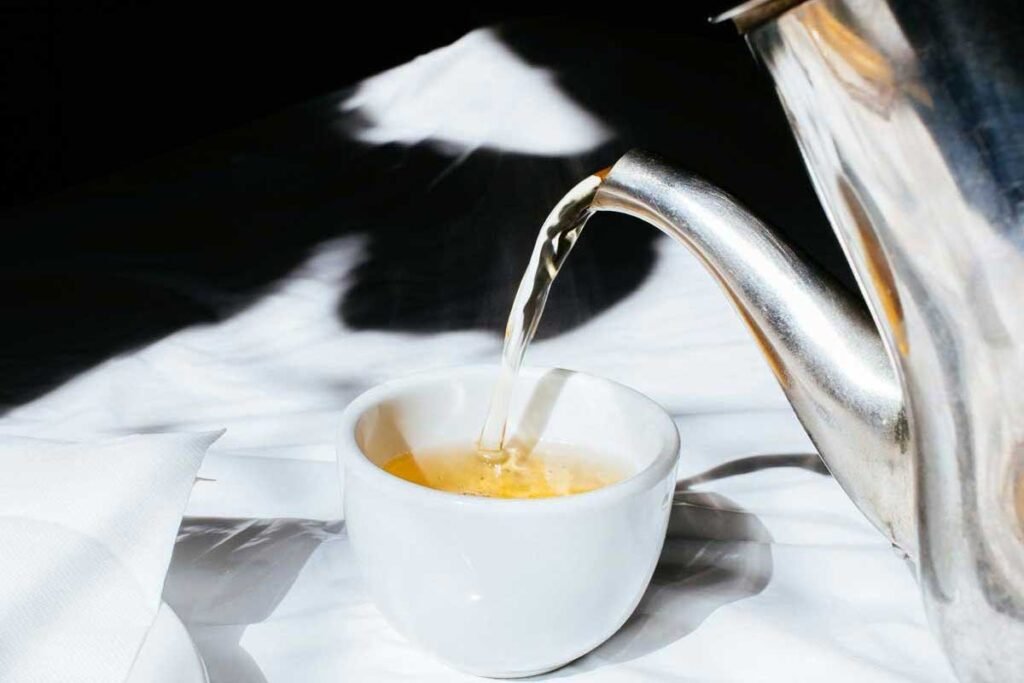 Pouring tea into a cup